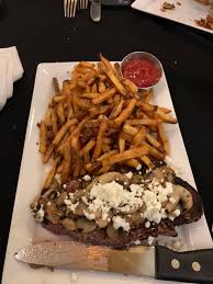 EnVie signature dishes Steak FritesDuck ConfitSeared ScallopsEscargots